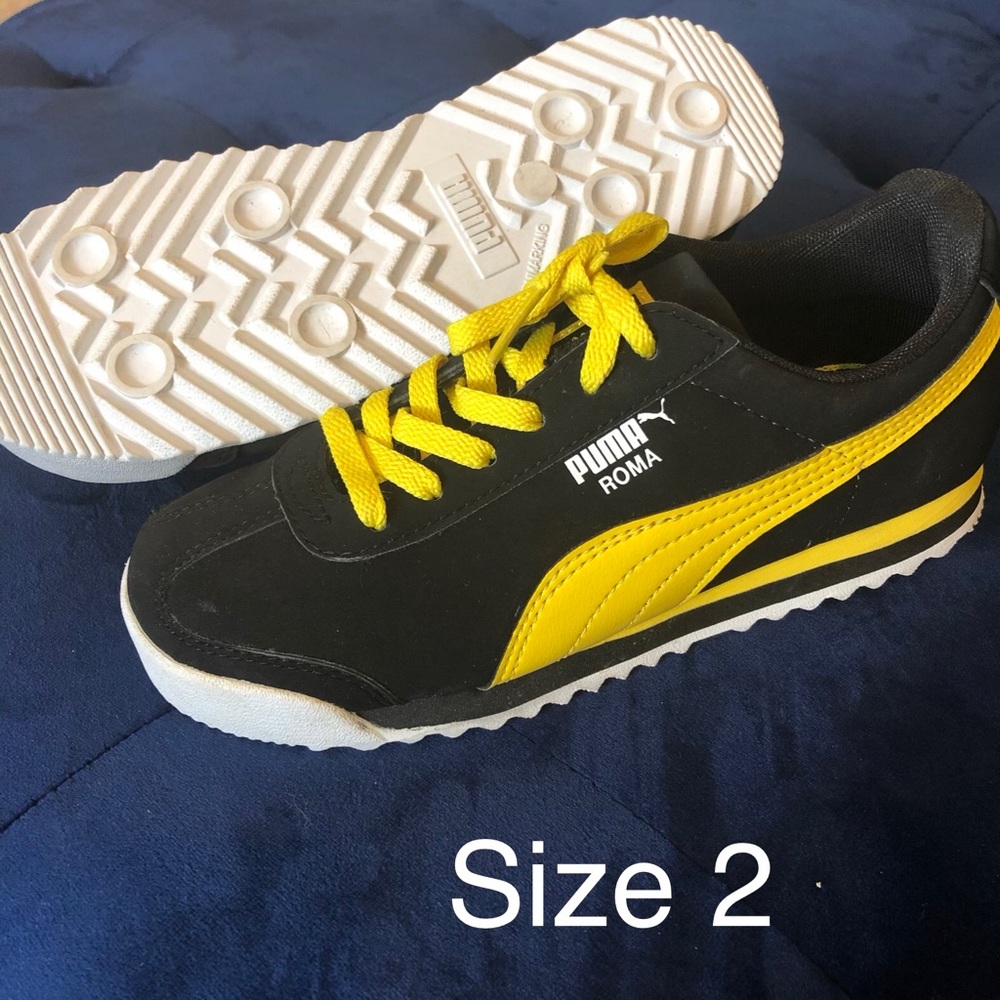 NWOT never worn Unisex Puma shoes size 2